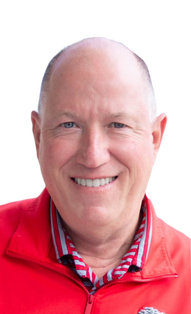A person is smiling while wearing a red jacket.