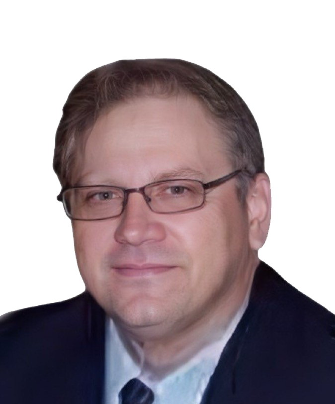 A person wearing glasses and a suit jacket is shown against a solid gray background.