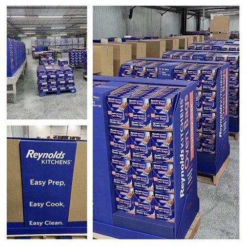 Stacks of Reynolds Kitchens foil packages are neatly organized on pallets in a warehouse setting.